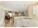Kitchen with white cabinets, marble countertops, and breakfast bar at 3283 Osprey Ln, Port Charlotte, FL 33953