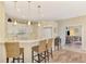 Modern kitchen with white cabinets, marble countertops, and breakfast bar at 3283 Osprey Ln, Port Charlotte, FL 33953