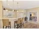 Modern kitchen with white cabinets, marble countertops, and breakfast bar at 3283 Osprey Ln, Port Charlotte, FL 33953