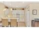 Bright kitchen boasts white cabinets and a marble countertop at 3283 Osprey Ln, Port Charlotte, FL 33953