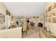 Open floor plan living room, kitchen, and dining area with hardwood floors at 3283 Osprey Ln, Port Charlotte, FL 33953