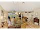 Open concept living room, kitchen, and dining area with hardwood floors at 3283 Osprey Ln, Port Charlotte, FL 33953
