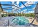 Relaxing pool and spa with a screened enclosure at 3283 Osprey Ln, Port Charlotte, FL 33953