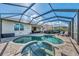 Enjoy this luxurious pool and spa, with plenty of space for relaxation at 3283 Osprey Ln, Port Charlotte, FL 33953