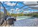 Inviting screened pool and spa with plenty of seating at 3283 Osprey Ln, Port Charlotte, FL 33953