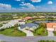 Single-Gathering home with a dark gray roof, located by a lake at 3310 Bay Ridge Way, Port Charlotte, FL 33953