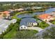 Aerial view of single-Gathering home community with water features at 3310 Bay Ridge Way, Port Charlotte, FL 33953