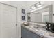 Bathroom with gray vanity, silver vessel sink, and blue tile at 3310 Bay Ridge Way, Port Charlotte, FL 33953