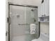 Clean bathroom with walk-in shower and white tile at 3310 Bay Ridge Way, Port Charlotte, FL 33953