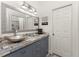 Modern bathroom with silver vessel sink and blue tile at 3310 Bay Ridge Way, Port Charlotte, FL 33953
