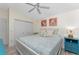Spacious bedroom with king-size bed, ceiling fan, and coastal decor at 3310 Bay Ridge Way, Port Charlotte, FL 33953