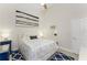 Bright bedroom with a queen-size bed and coastal decor at 3310 Bay Ridge Way, Port Charlotte, FL 33953