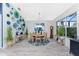 Bright dining room with wood table and unique wall art at 3310 Bay Ridge Way, Port Charlotte, FL 33953