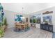 Spacious dining area with large windows and elegant furnishings at 3310 Bay Ridge Way, Port Charlotte, FL 33953