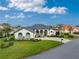 Single-story home with tile roof, landscaped yard, and driveway at 3310 Bay Ridge Way, Port Charlotte, FL 33953