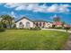 Beautiful home exterior with landscaping and driveway at 3310 Bay Ridge Way, Port Charlotte, FL 33953