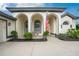 Welcoming front porch with arched entryway at 3310 Bay Ridge Way, Port Charlotte, FL 33953