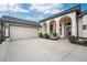 Attached two-car garage with paver driveway at 3310 Bay Ridge Way, Port Charlotte, FL 33953