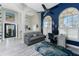Bright home office features wood floors, built-in shelving, and a comfortable sitting area at 3310 Bay Ridge Way, Port Charlotte, FL 33953