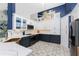 Modern kitchen with white and navy cabinets, quartz countertops at 3310 Bay Ridge Way, Port Charlotte, FL 33953
