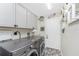 Laundry room with LG washer and dryer, and ample storage at 3310 Bay Ridge Way, Port Charlotte, FL 33953