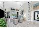 Spacious living room with vaulted ceiling, light flooring, and pool view at 3310 Bay Ridge Way, Port Charlotte, FL 33953