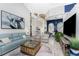 Bright and airy living room with light blue couch and wicker chairs at 3310 Bay Ridge Way, Port Charlotte, FL 33953