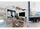 Open living space with a large TV, seating area, and kitchen view at 3310 Bay Ridge Way, Port Charlotte, FL 33953