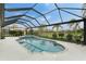 Enclosed pool and spa area with a patio table and chairs at 3310 Bay Ridge Way, Port Charlotte, FL 33953