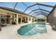 Inviting pool area with covered lanai, spa, and ample seating at 3310 Bay Ridge Way, Port Charlotte, FL 33953