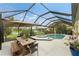 Spacious patio with pool, spa, and outdoor dining at 3310 Bay Ridge Way, Port Charlotte, FL 33953