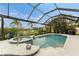 Screened pool and spa with tropical landscaping at 3310 Bay Ridge Way, Port Charlotte, FL 33953
