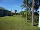 Large backyard with tropical landscaping at 380 Hoffer St, Port Charlotte, FL 33953