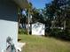 Landscaped backyard with storage shed at 380 Hoffer St, Port Charlotte, FL 33953