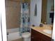 Clean bathroom with shower/tub combo and dark wood vanity at 380 Hoffer St, Port Charlotte, FL 33953