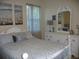 Well-lit bedroom with white furniture and calming decor at 380 Hoffer St, Port Charlotte, FL 33953