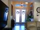 Bright and airy entryway with double doors and stained glass at 380 Hoffer St, Port Charlotte, FL 33953