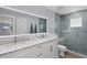 Modern bathroom with double vanity and glass shower at 396 N Gulf Blvd, Placida, FL 33946
