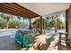Wooden patio with table and chairs under the house at 396 N Gulf Blvd, Placida, FL 33946