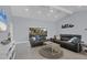 Bright living room with sectional sofa and large windows at 396 N Gulf Blvd, Placida, FL 33946
