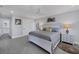 Main bedroom with king-size bed, dresser, and ceiling fan at 396 N Gulf Blvd, Placida, FL 33946