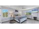 Main bedroom with king-size bed and ensuite bathroom at 396 N Gulf Blvd, Placida, FL 33946