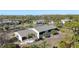 Aerial view of property, showcasing building and waterfront views at 4260 Placida Rd # 24B, Englewood, FL 34224