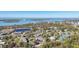 Community overview with tennis courts and waterfront view at 4260 Placida Rd # 24B, Englewood, FL 34224