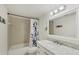 Bathroom features a tub shower combo and updated vanity at 4260 Placida Rd # 24B, Englewood, FL 34224