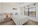 Guest bedroom with a full-size bed and large window at 4260 Placida Rd # 24B, Englewood, FL 34224