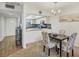 Charming dining area with four chairs and a view of the kitchen at 4260 Placida Rd # 24B, Englewood, FL 34224