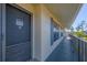 Exterior condo hallway with a dark gray metal railing at 4260 Placida Rd # 24B, Englewood, FL 34224