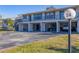 Condo building with parking under the building and additional parking in front at 4260 Placida Rd # 24B, Englewood, FL 34224