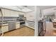 Open kitchen with stainless steel appliances and view into living area at 4260 Placida Rd # 24B, Englewood, FL 34224